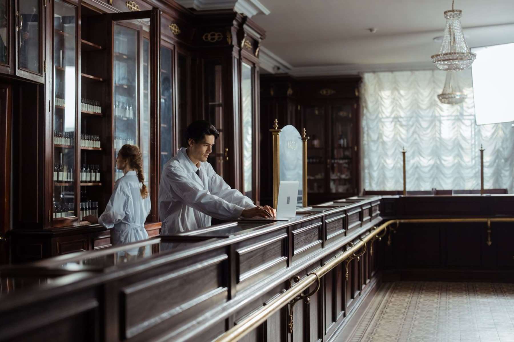 A friendly pharmacist at the counter